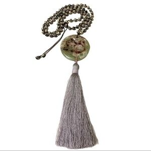 Beaded necklace with stone pendant and tassel